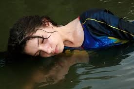 woman reflecting in water